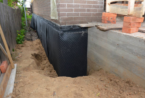 SJ Waterproofing Pros technician performing targeted Foundation Crack Repair assessment in Butler, KY